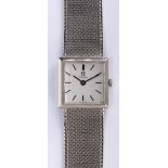Lady's 18k white gold wristwatch Dial: square, silvered, applied black baton hour markers, black
