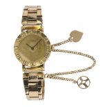 Tiffany & Co Atlas 18k yellow gold wristwatch Dial: round, gold tone, black baton hands, Tiffany &