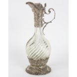Dutch Export .833 silver mounted claret jug, the Renaissance Revival fittings detailed with repoussé
