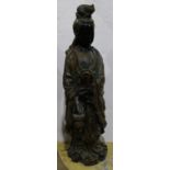 Large metal sculpture of a Chinese female deity, standing and holding an electrified lotus lamp,