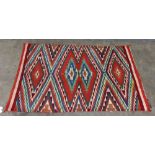 Navajo Germantown "eyedazzler" blanket, circa 1900, with vibrant diamond patterning in green, red,