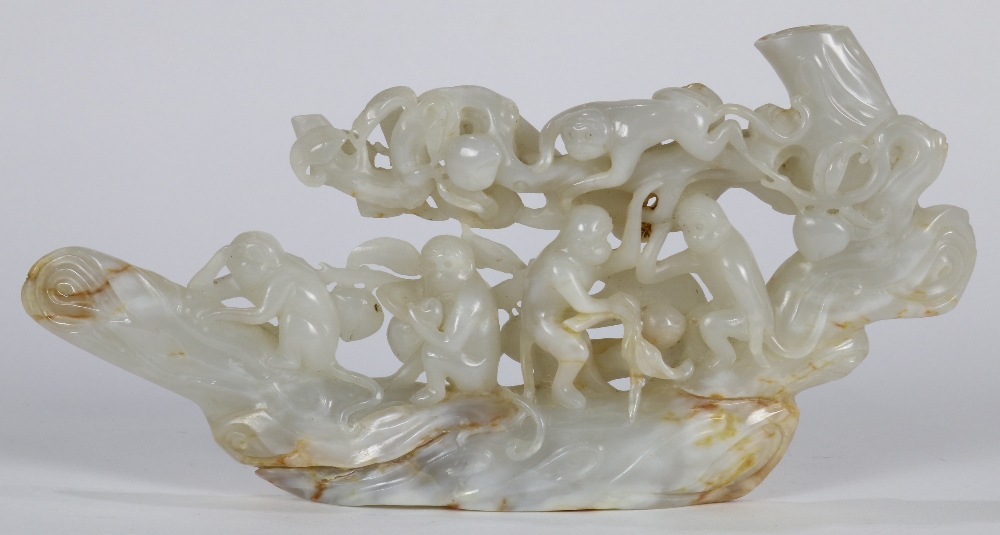 Chinese jade sculpture, a group of five monkeys with some climbing on a peach tree, the off-white