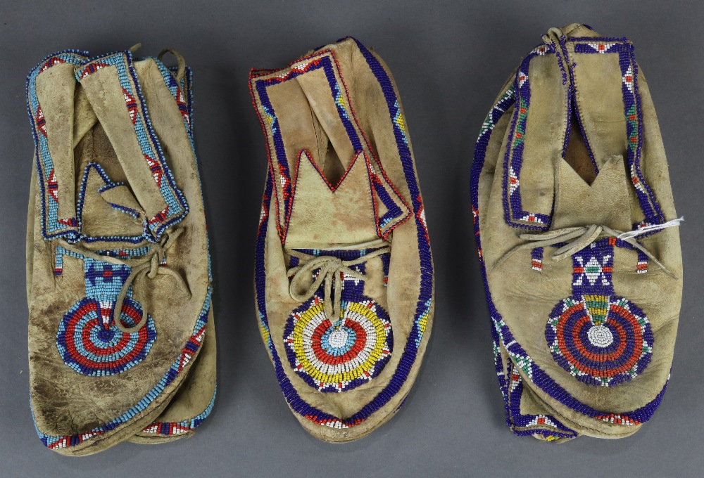 (Lot of 3 pairs) Native American beaded mocassins group, each having polychrome geometric decoration