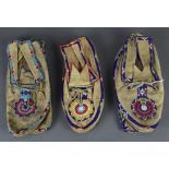 (Lot of 3 pairs) Native American beaded mocassins group, each having polychrome geometric decoration