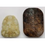 (lot of 3) Chinese hardstone archaistic buckles, consisting of two of mask form; and the other of