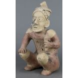 Pre-Columbian Nayarit style seated figure, having distinct features with open mouth, holding a