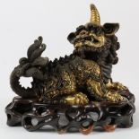 (lot of 2) Chinese gilt bronze mythical beasts, one of a dragon on all fours together with a fu-lion