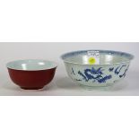 (lot of 2) Chinese porcelain bowls, the first with an ox-blood glaze; the second with underglaze