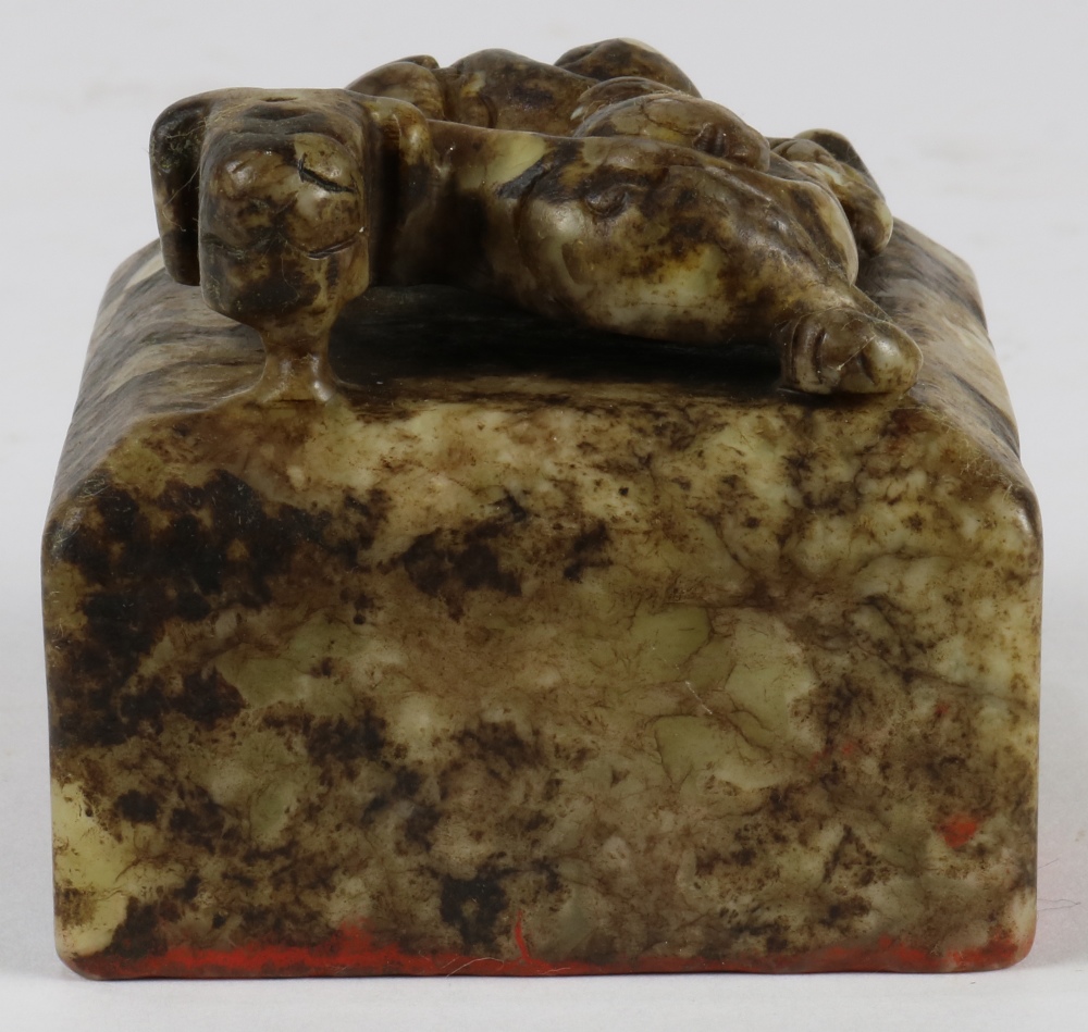 Chinese hardstone seal, topped with a mythical beast above a square seal, the underside with four