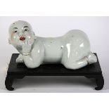 Chinese porcelain pillow, in the form of a baby on all fours, with stand, pillow: 10"w