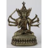 Himalayan white metal Buddhist sculpture, the four headed deity with eight arms holding various