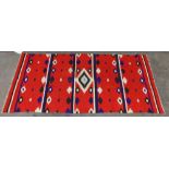 Rio Grande/Germantown Navajo "eyedazzler" blanket, early 20th Century, the vibrant red ground with