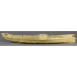 Native American hide model canoe, inscribed "Suzanna" and "Nome Alaska", bears a series of