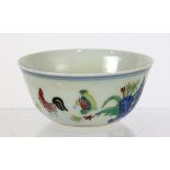 Chinese wucai porcelain cup, decorated with rooster, hen and chicks amid flowers and garden rocks,