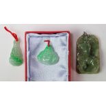 (Lot of 3) Jade pendants comprised of (1) jadeite plaque, measuring approximately 39 x 27.9 x 10.4