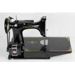 Singer featherweight 221 sewing machine, retaining the original case, overall: 11"h x 14.5"w x 8"d