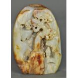 Chinese hardstone boulder, carved with a scholar under a pine tree, with russet inclusions set