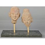 South Asian ceramic heads, featuring one having hair in an updo and earring, head: 5.75"h