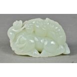 Chinese jade figural carving, with a monkey on the back of a recumbent horse, executed from a