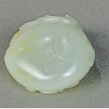 Chinese jade toggle, carved with the Three Auspicious Fruits, peach, pomegranate and Buddha hand