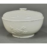 Chinese Dehua porcelain tureen, the lid and body molded with peony scrolls, 8"w