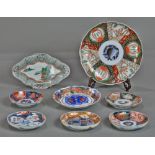 (lot of 8) Japanese Imari dishes, 19th/20th century: six circular, one foliated rhombus form, one