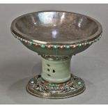 Mongolian silver footed bowl, inset with jade and hardstones, 19th century, the shallow bowl with