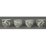 (lot of 4) Chinese enameled porcelain planters: the first pair featuring various flowers; the second