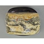 Chinese soapstone desk ornament, of mottled gray patches in contrast with a cream colored ground,