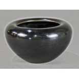 Chinese black glazed porcelain vessel, with wide shoulders and tapering body, base with apocryphal