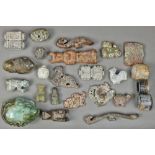 (lot of 24) One tray of Chinese archaistic hardstone carvings, including figures, zoomorphs, belt