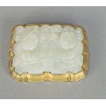 Chinese jade plaque now mounted as a brooch, the rectangular plaque carved with two children holding