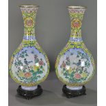 (lot of 2) Chinese enameled yellow ground copper vases, with a trumpet neck above a pear shaped body