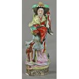 Chinese enameled porcelain figure, featuring Magu holding a basket and ruyi scepter, accompanied