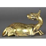 Chinese gilt bronze qilin, the recumbent animal with its head turned backward, 6.25"w