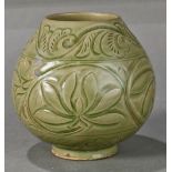 Chinese Yaozhou type ceramic jar, of bud form carved with lotus scrolls, raised on a low foot, 4.5"