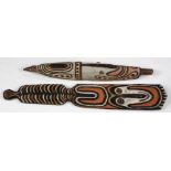 (lot of 2) New Guinea carving group, consisting of a figural spirit board, together with a