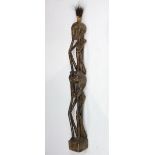 Double figural wood sculpture in a modern primitive style, possibly cared in Indonesia, 56"h