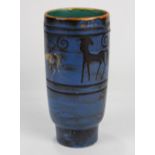 German Mid Century vase, having a blue exterior with stylized horse reserves, and rising on a