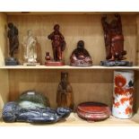 (lot of 10) Two shelves of mostly Chinese decorative items, including seven figural carvings; a