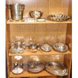 Three shelves of associated silverplate table articles, including salts, serving platters, tobacco