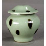 Chinese spotted celadon glazed lidded ceramic jar, the vessel with a wide shoulder and tapering