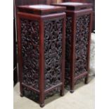 Pair of Chinese wooden plant stands, the top inset with circular marble plaque, the sides panels