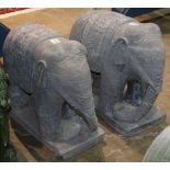 Pair of Chinese elephant sculptures, each draped with a floral blanket on its back, and raised on