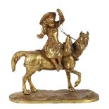 Continental gilt bronze figural sculpture of a child on horseback, rising on a naturalistic base,