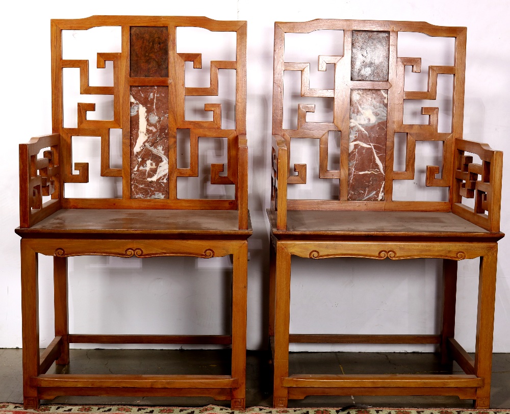 Pair of Chinese wooden armchairs, the back inset with pink marble plaque accented by an openwork