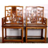 Pair of Chinese wooden armchairs, the back inset with pink marble plaque accented by an openwork