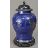 Chinese gilt decorated blue ground porcelain jar, with a globular body and tall splayed foot,