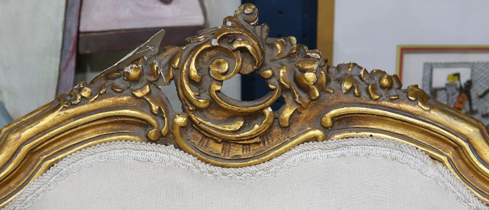 (lot of 2) Louis XV style giltwood bergeres, each having a floral carved crest, above a cream - Image 2 of 2