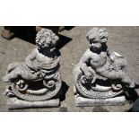 Pair of Victorian cast garden elements depicting reclining putti, 26"h x 18"w